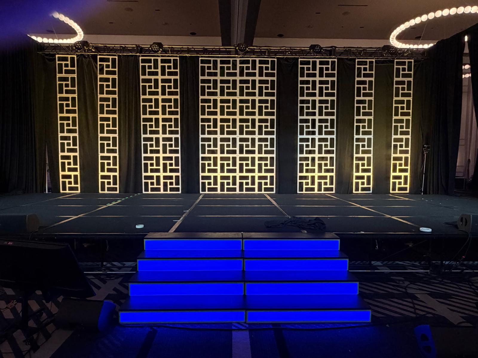 LED-lit neon scenic stairs fabricated by MartinBuilt LLC